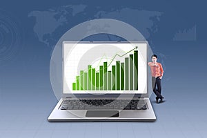 Business bar chart on laptop and businessman