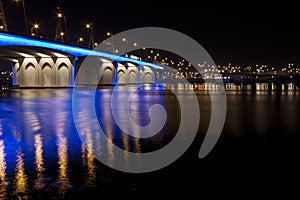 Business Bay bridge blue lit
