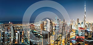 Business bay, Dubai, United Arab Emirates. Colourful nighttime skyline with world tallest skyscrapers.