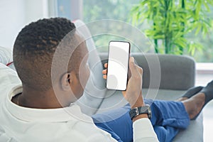 Business black american man, African person using a smartphone or mobile phone with blank screen space on webcam video call