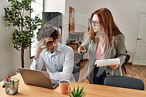 Business boss angry with stressed employee at the office