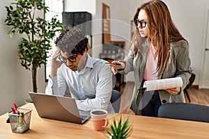 Business boss angry with stressed employee at the office