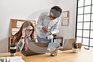 Business boss angry with stressed employee at the office