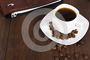 Business breakfast with coffee cup and notebook decorated with c