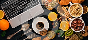 Business breakfast, muesli, coffee, milk, fruits, nuts and seeds, on a wooden surface. Top view.