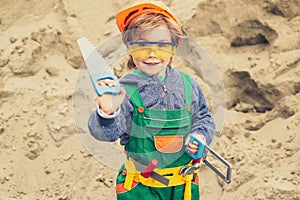 Business, building, industry, technology, builder concept. Young builder in hard hat. Close up engineers working