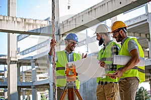 Business building teamwork people concept. Group of engineer with blueprint on construction site