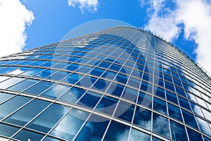 Business building window wall against blue sky