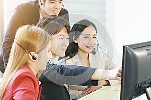 Business Call Center and technical Support staff for receptionist phone operator Discussing and working for teamwork with computer