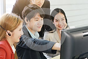 Business Call Center and technical Support staff for receptionist phone operator Discussing and working for teamwork with computer