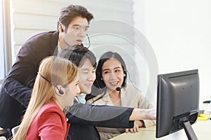 Business Call Center and technical Support staff or receptionist phone operator Discussing and working for teamwork with computer