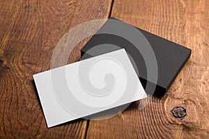 Business card blank on wooden background. Corporate Stationery, Branding Mock-up. Creative designer desk. Flat lay. Copy