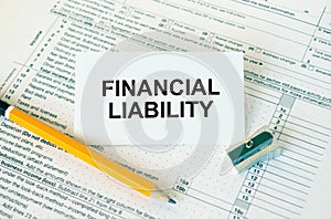 Business card with text Financial Liability on financial docs