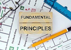 Business card with text Fundamental Principles on a construction drawing