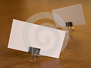Business cards with paperclip fastener on a desk