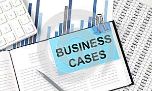 BUSINESS CASES text on blue sticker on the chart background near calculator
