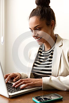 Business casual woman working from home on laptop