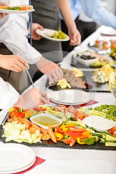 Business catering people take buffet food