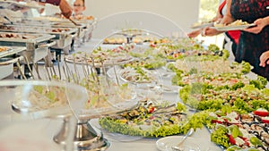 Business catering people take buffet food during company event