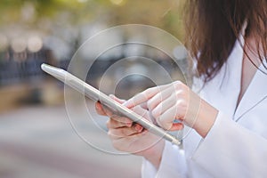 Business cauasian woman hand with digital device photo