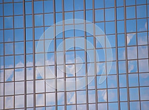 Business center. Glass facade background blue sky reflection. Modern architecture. Construction and design. Commercial