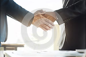 Business ceo hands shaking while meeting selected focus on hands