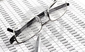 Business chart, pen and glasses. Business concept