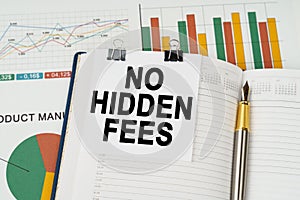 On the business charts is a notepad with the inscription - No hidden fees
