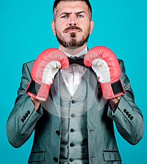 Business coach. businessman in formal suit and bow tie. bearded man in boxing gloves punching. Business and sport