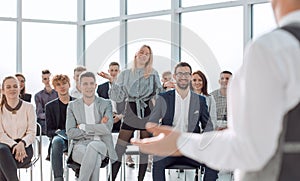 business coach at a meeting with a group of young business people