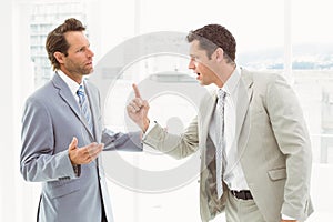 Business colleagues in argument at office photo