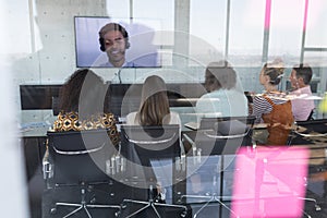 Business colleagues attending a video call in a conference room