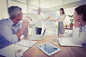 Business colleagues conducting presentation