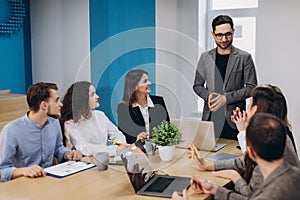 Business colleagues in conference meeting room during presentation