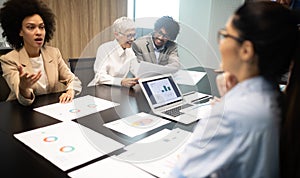 Business colleagues in conference meeting room presentation