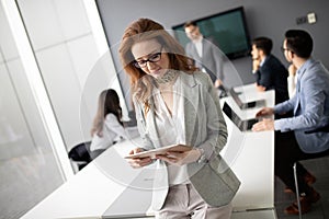 Business colleagues in conference meeting room during presentation