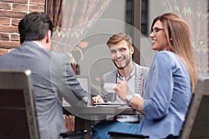 Business colleagues discussing business issues at the coffee table