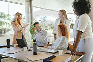 Business colleagues enjoying working together in the office