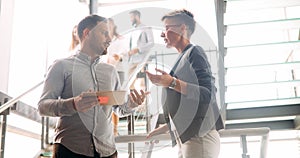 Business colleagues having conversation during coffee break