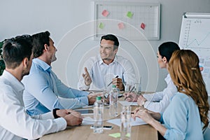 business colleagues having discussion at workplace
