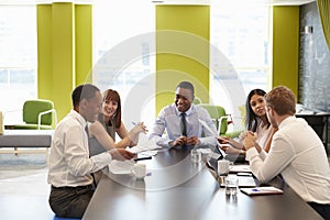 Business colleagues having an informal meeting at work photo