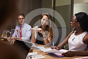 Business colleagues at a meeting in boardroom, close up