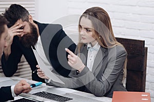 Business colleagues at meeting, office background. Office atmosphere concept. Lady manager tries to organize working