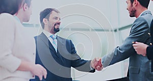 Business colleagues sitting at a table during a meeting with two