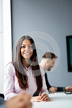 Business colleagues in conference meeting room during presentation