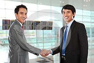 Business colleagues shaking hands