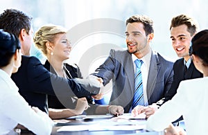 Business colleagues sitting at a table during a meeting