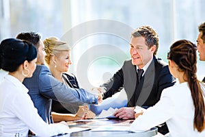 Business colleagues sitting at a table during