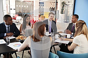 Business colleagues talking in a meeting room
