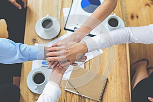 Business colleagues with their hands joined together